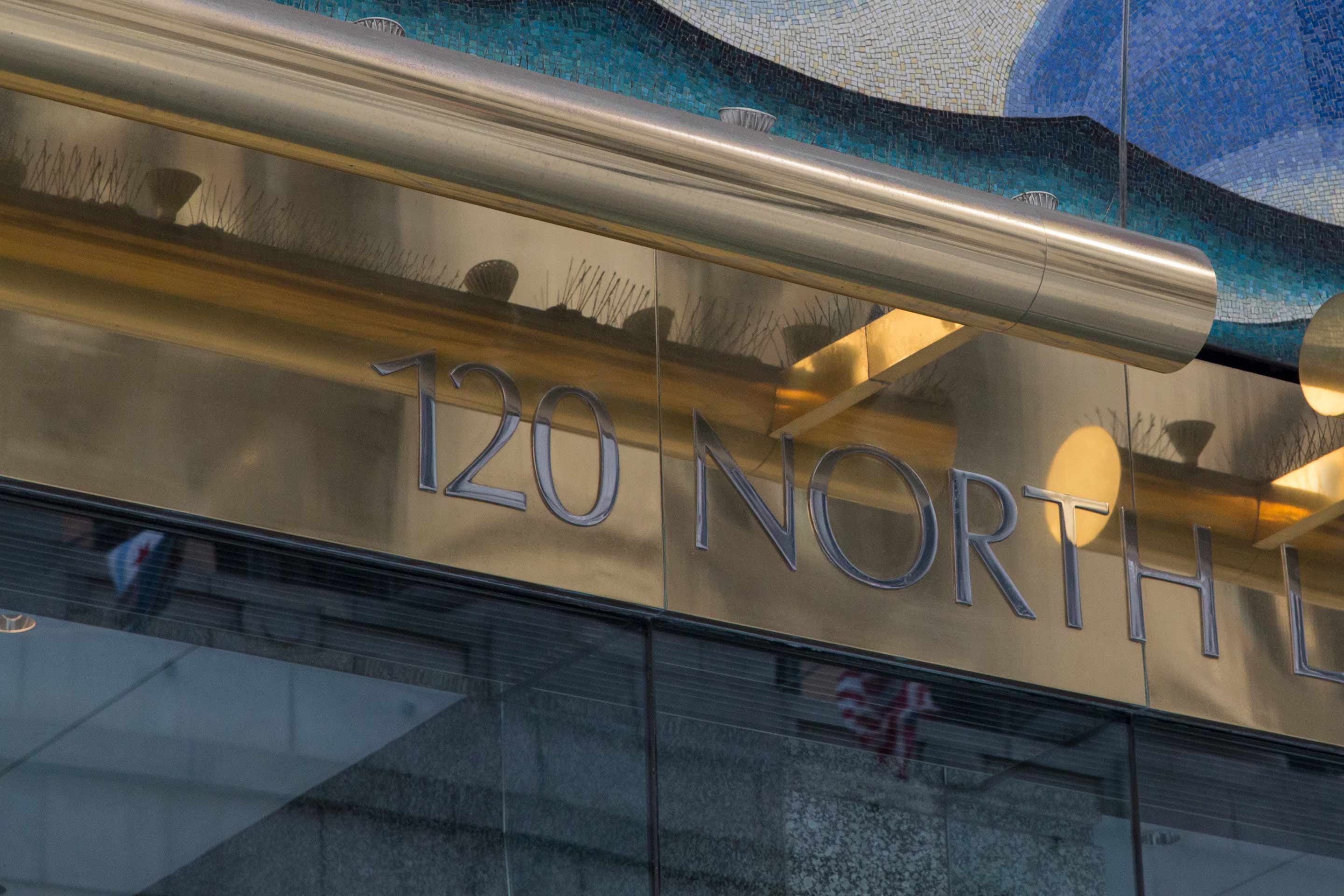 Muntz Metal signage at the entrance of 120 North LaSalle