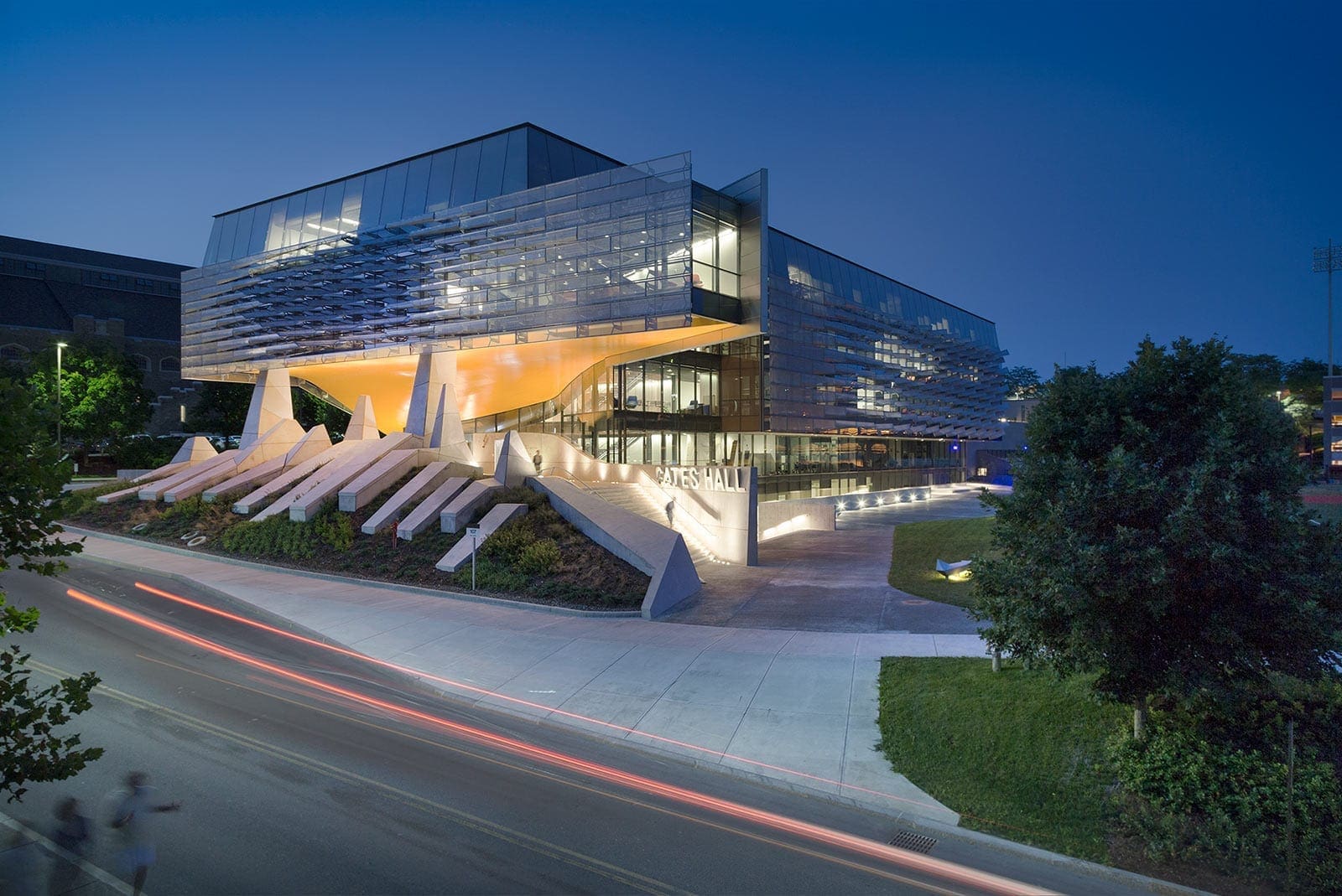 Photograph of the Gates Hall at night.