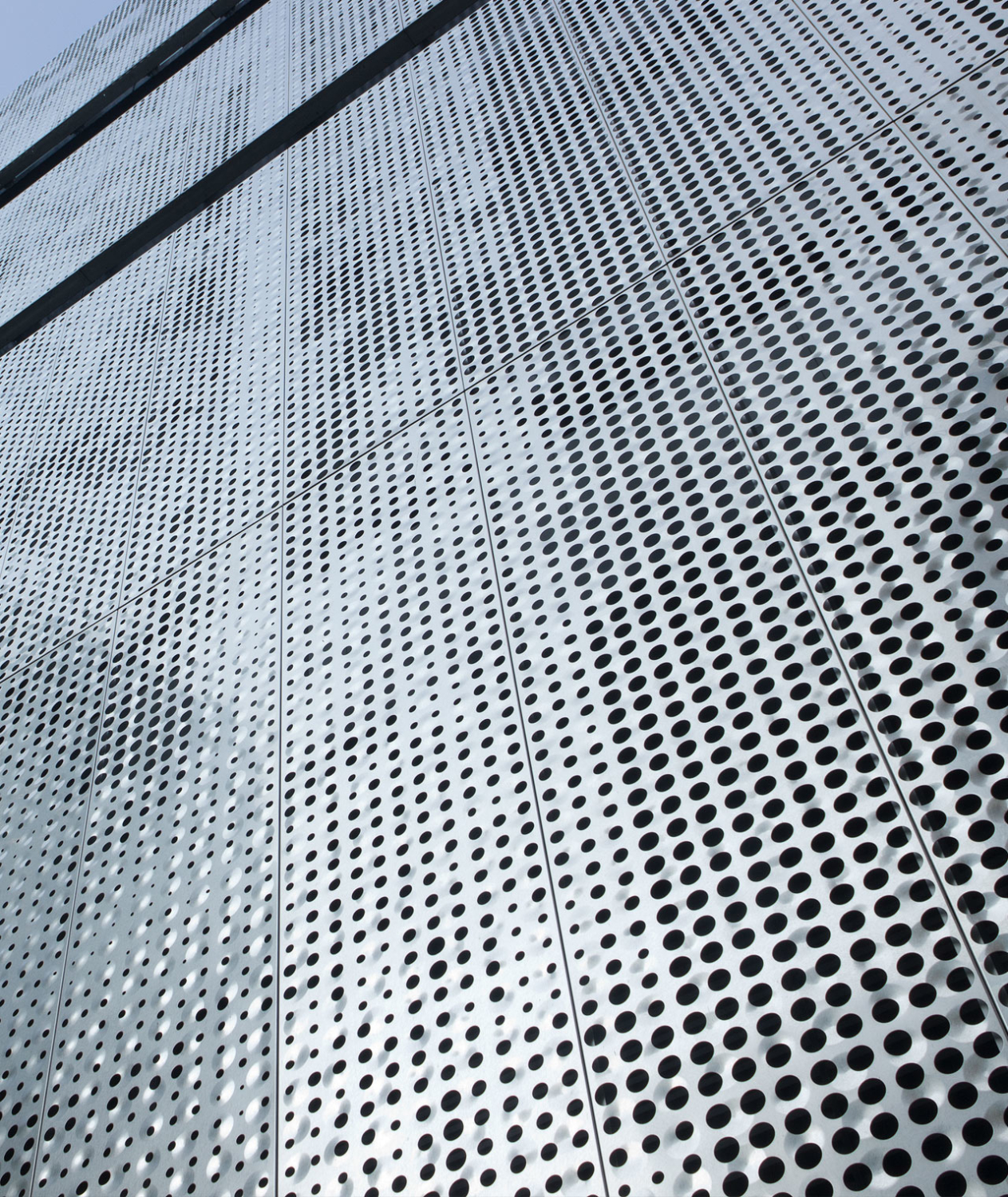 Detail of the perforated metal facade on Fairmont Pacific Rim