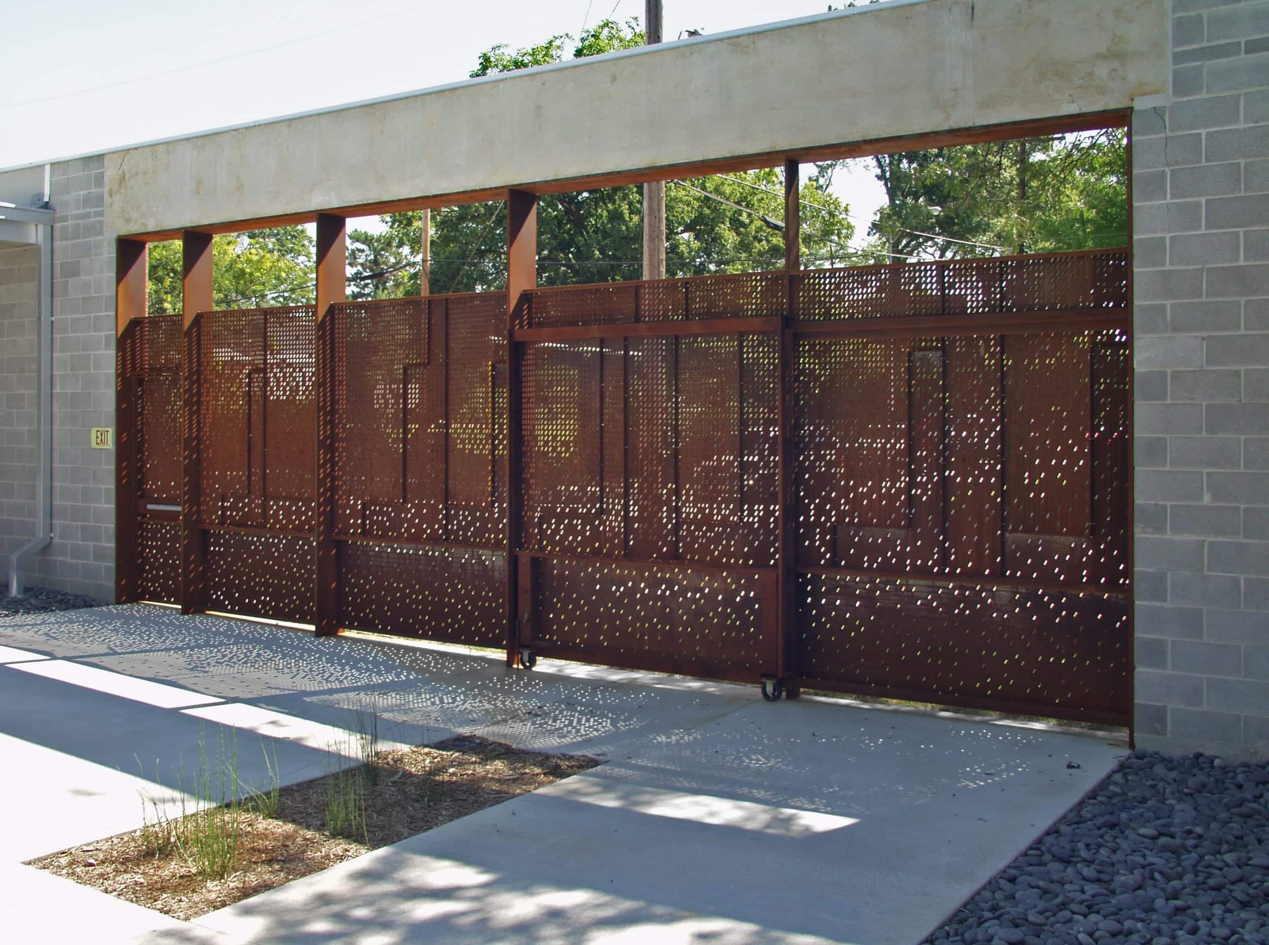 Light enters the space through the custom perforated metal for the Irving Courtyard Screenwall.