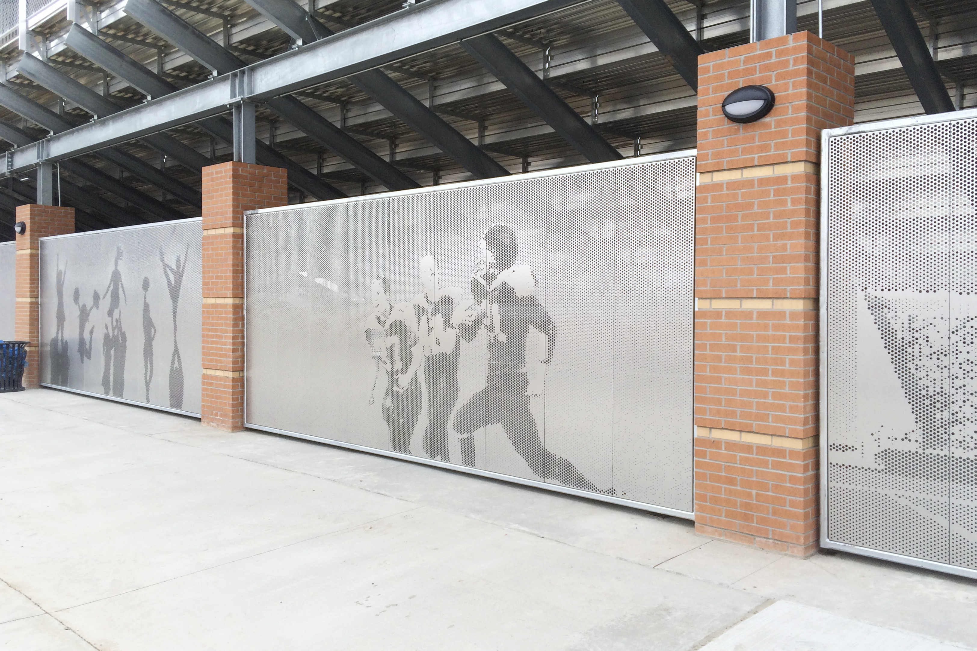 Custom privacy screens provide passive security and vibrant aesthetics for the Okie Blanchard Sports Complex.