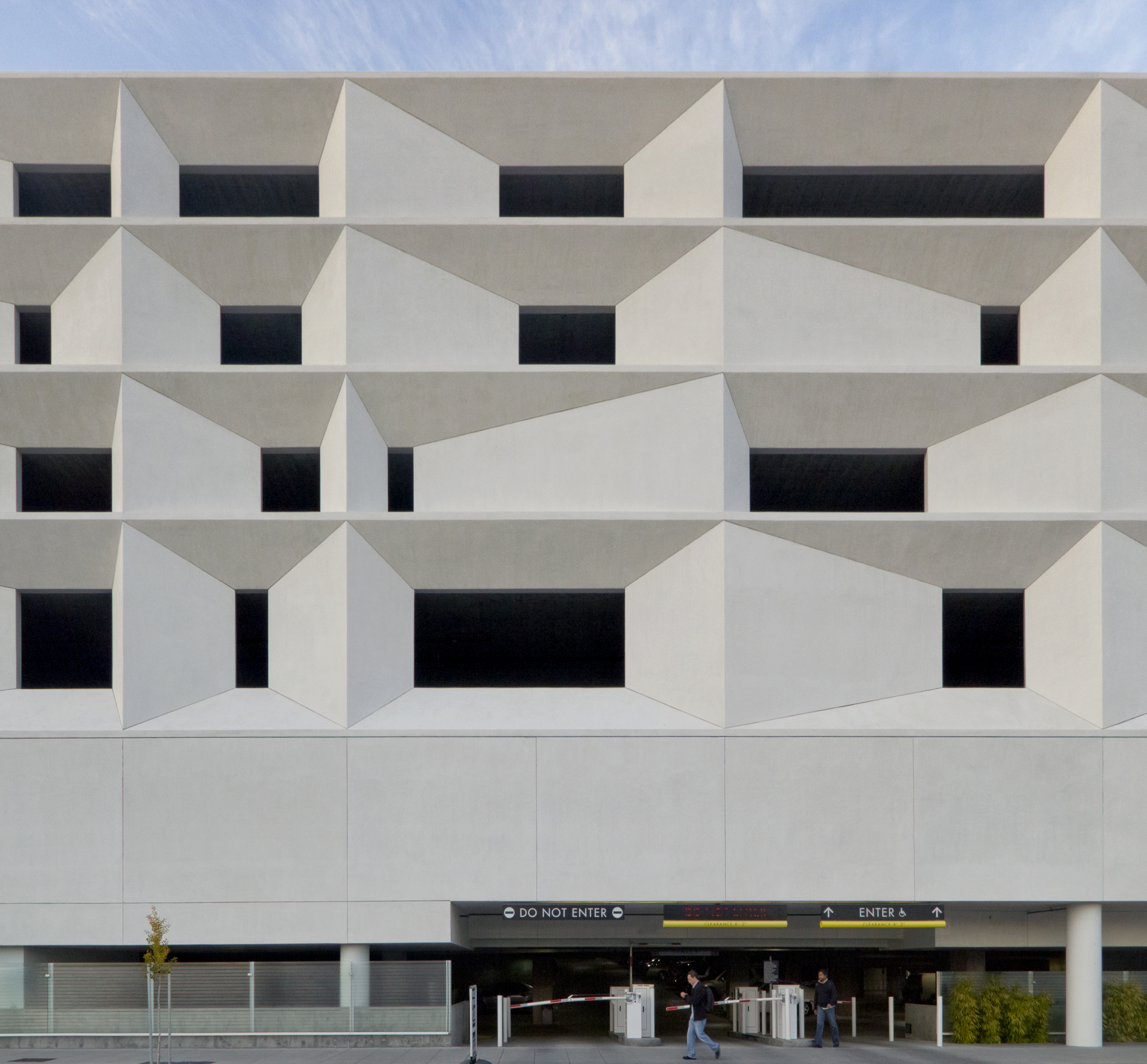 The northwest and south sides of the parking structure feature an intriguing stucco facade.
