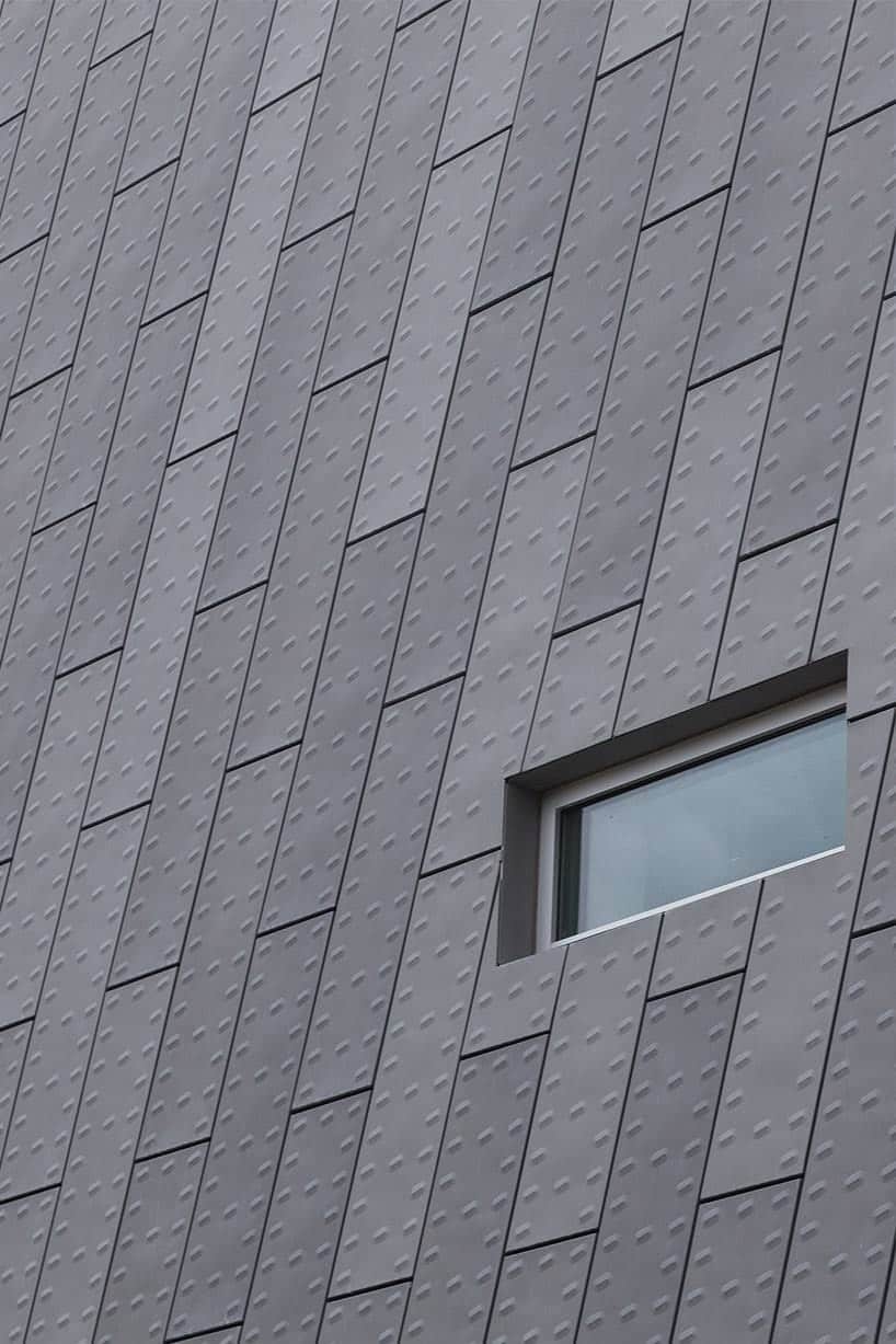 The building facade has an appearance of armored cladding.