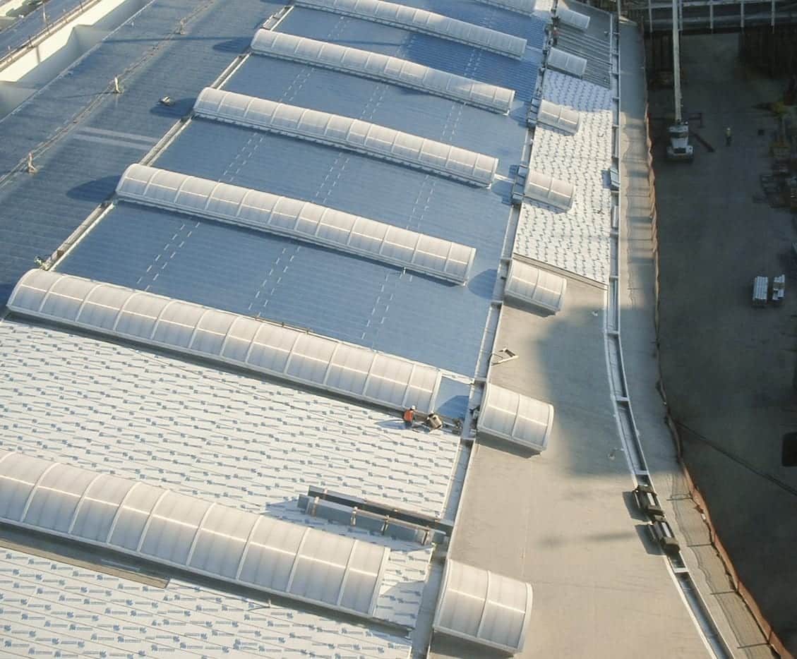 Zahner roofing team installs the stainless steel skins on the DFW Terminal D roof.