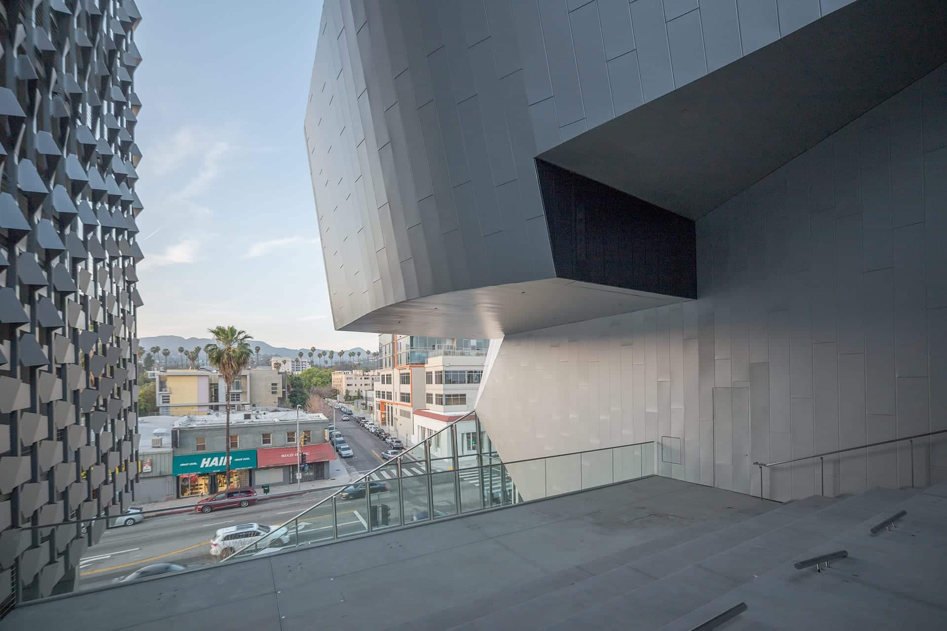 View of Sunset Blvd and Hollywood Hills through the piazza stairway at Emerson LA.