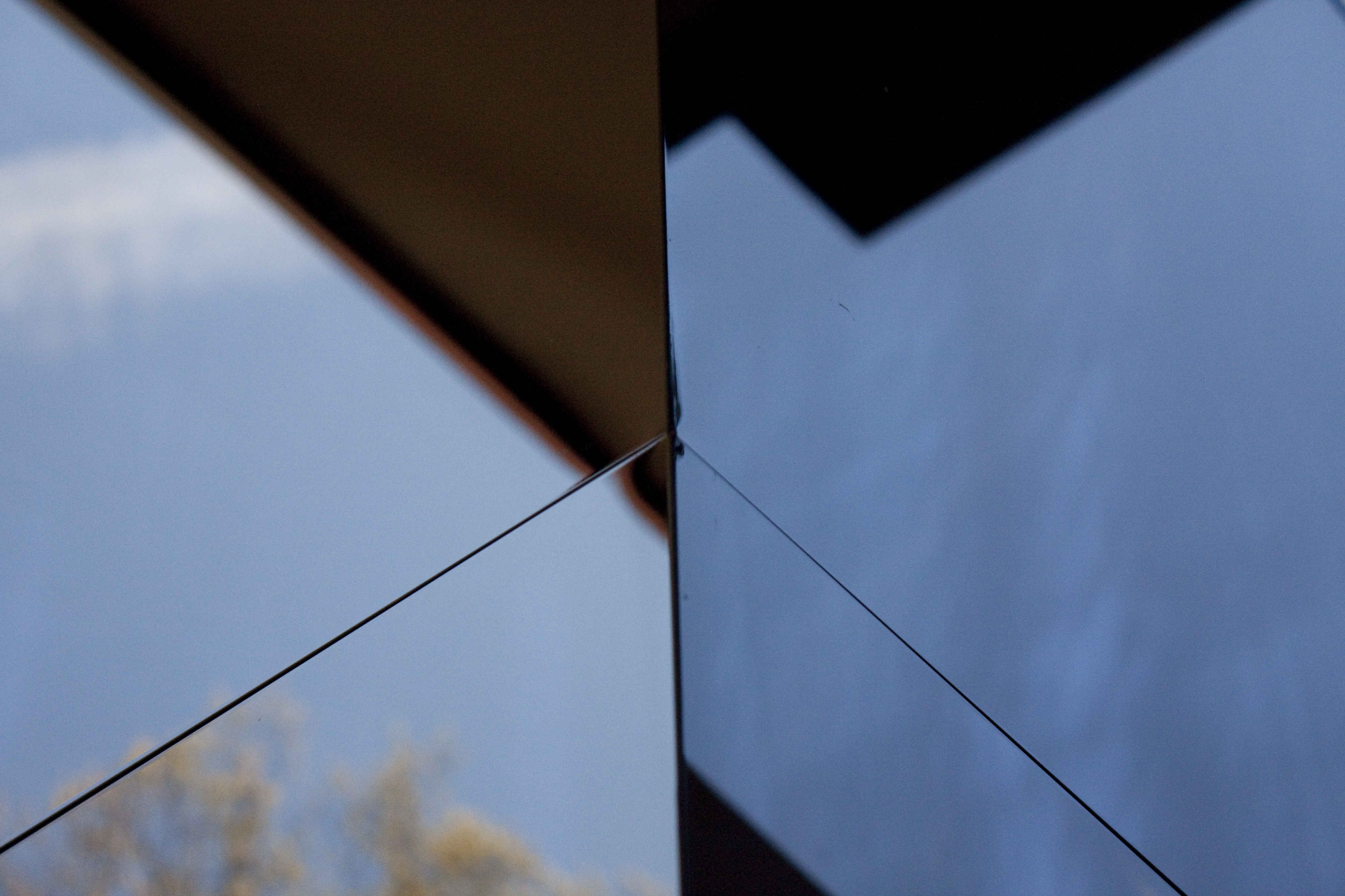 Black mirror interference stainless steel clads both the interior and exterior of the Gaines Residence