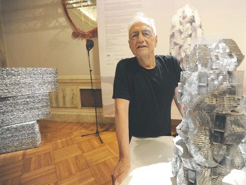 Frank Gehry with model for Parc des Ateliers.