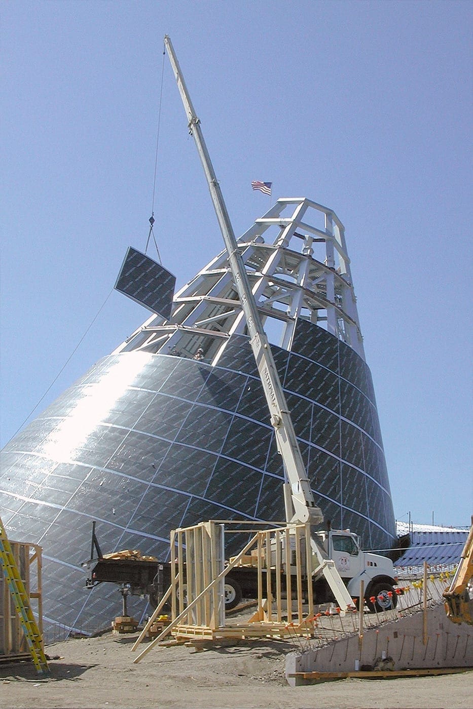 A single ZEPPS assembly is lifted into place on the Museum of Glass