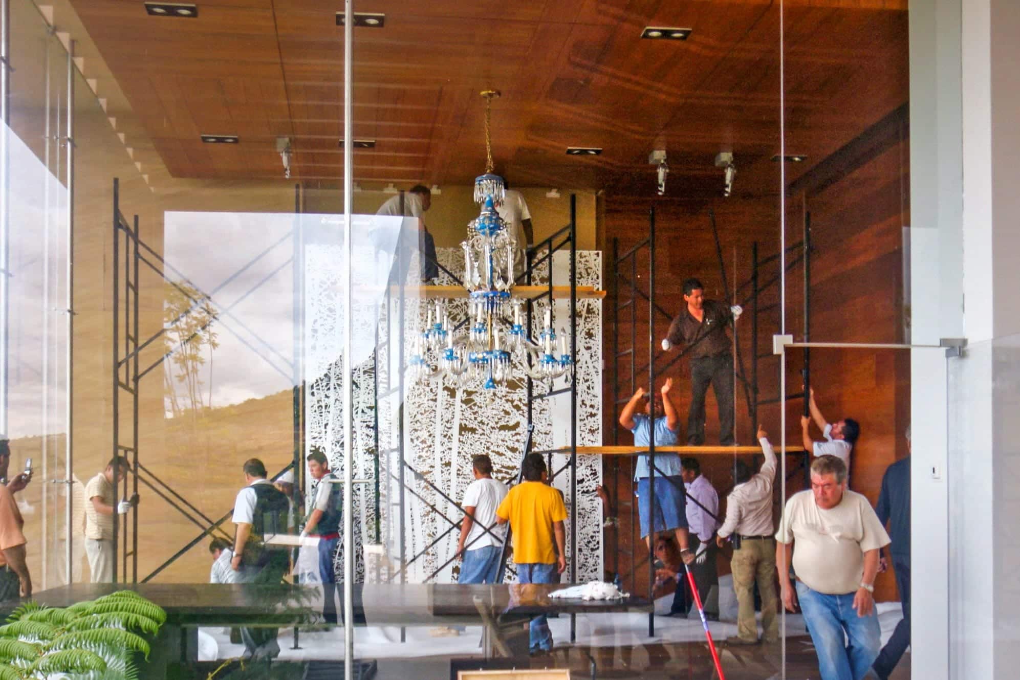 Installers place the large aluminum artwork by Jan Hendrix.