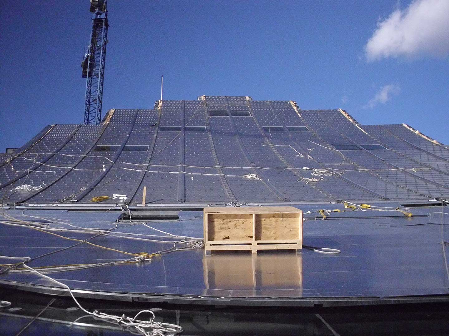 Field operators install the ZEPPS™ Panels on the South roof of Kauffman Center.