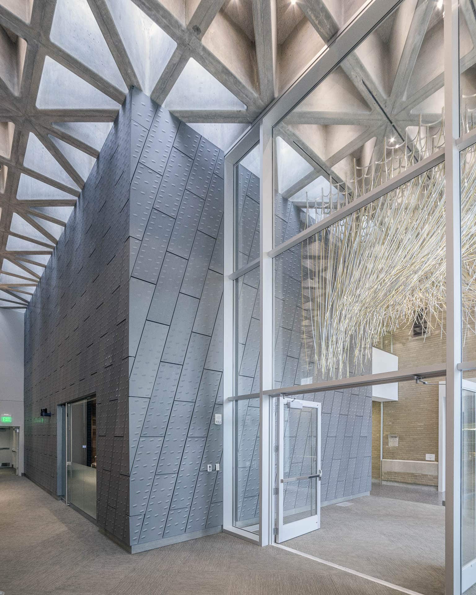 Interior space with custom zinc feature wall at KCPD Headquarters.