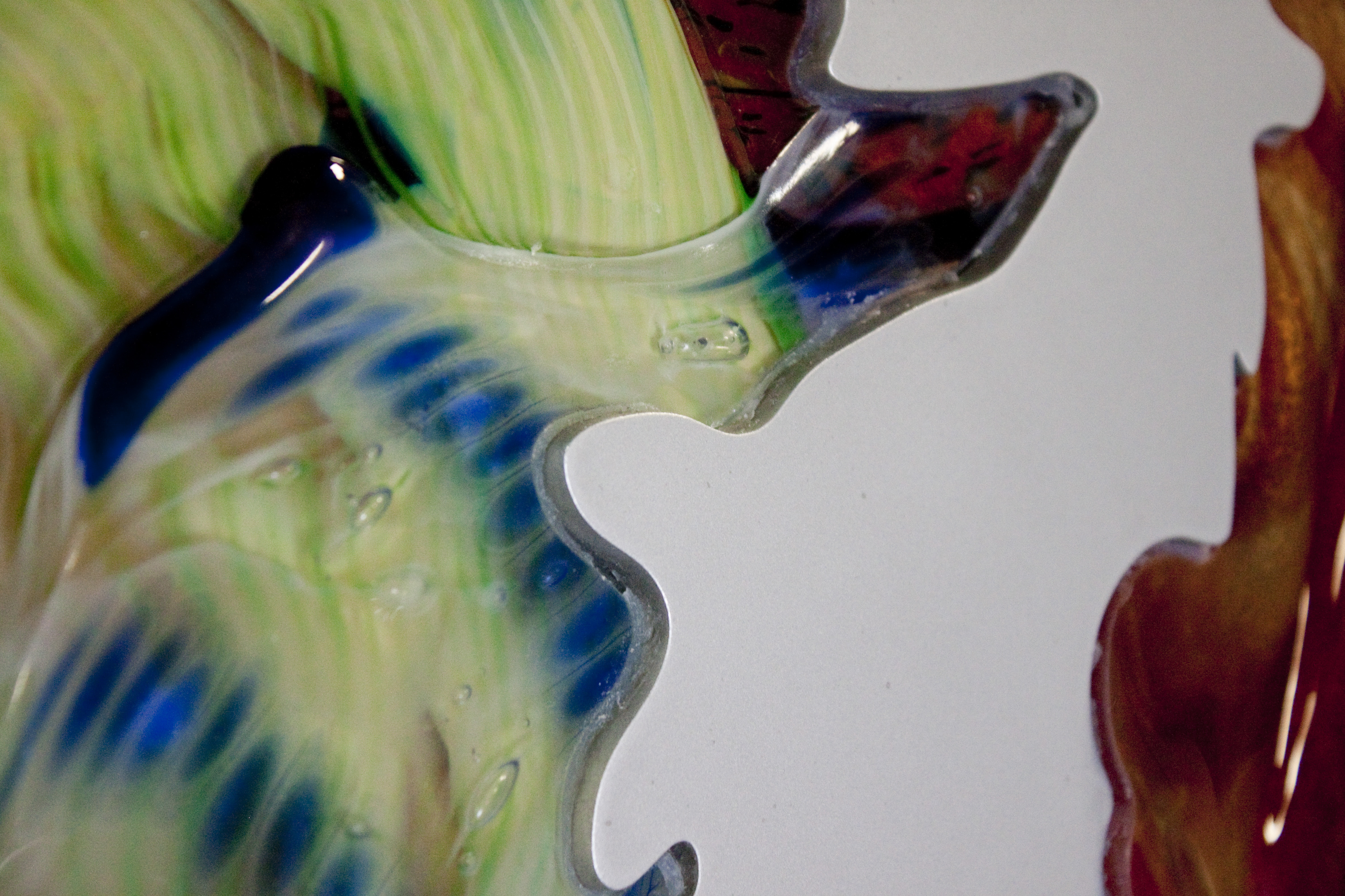 Glass inlays on the aluminum surface.