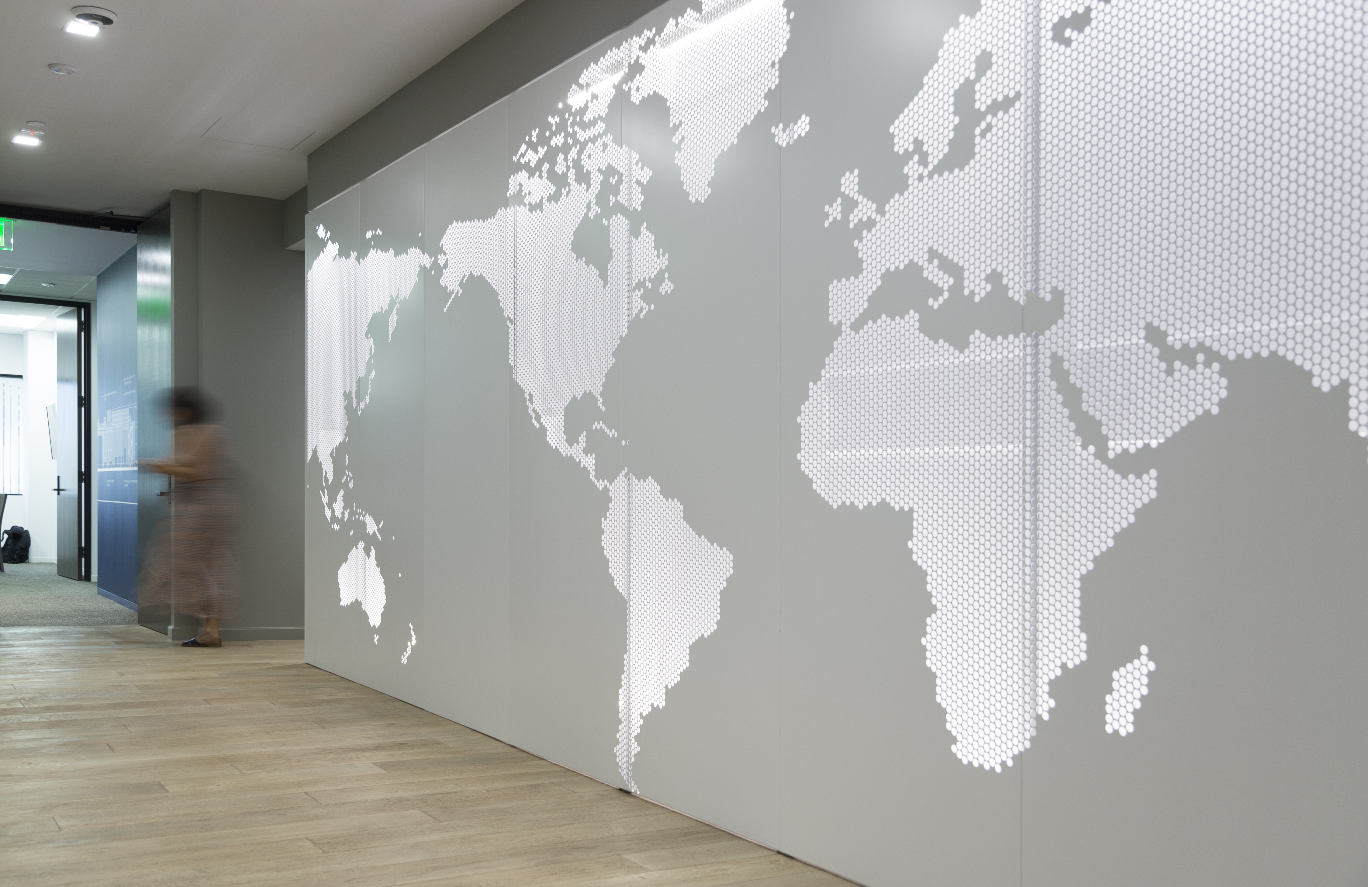 Interior metal ImageWall system with backlit painted aluminum panels.