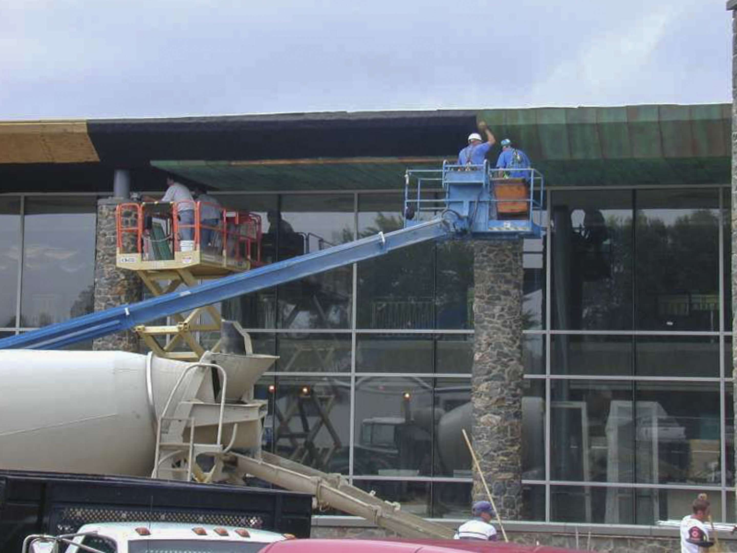 Installers hang the copper panels