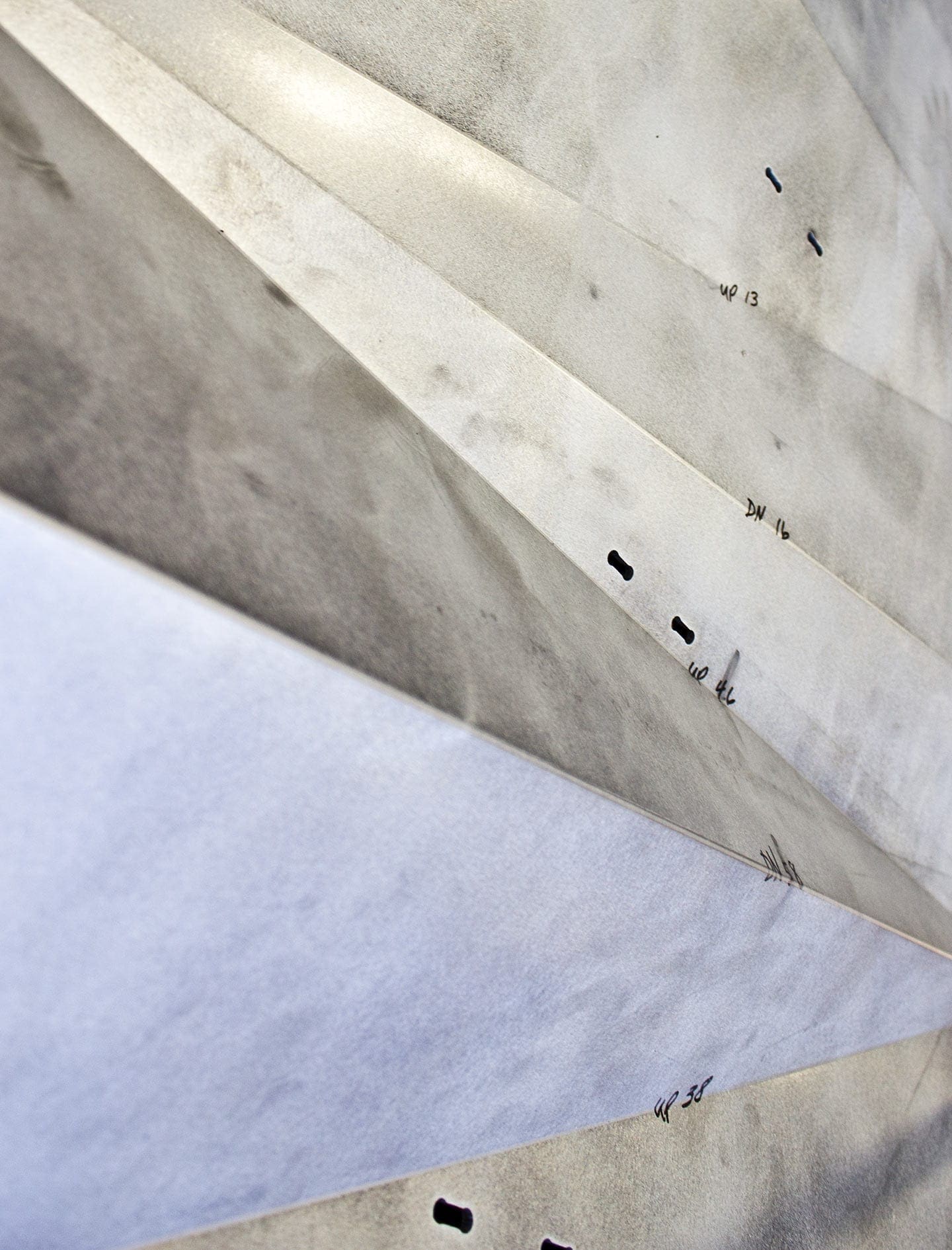 Aluminum profiles with notches cut for clips.
