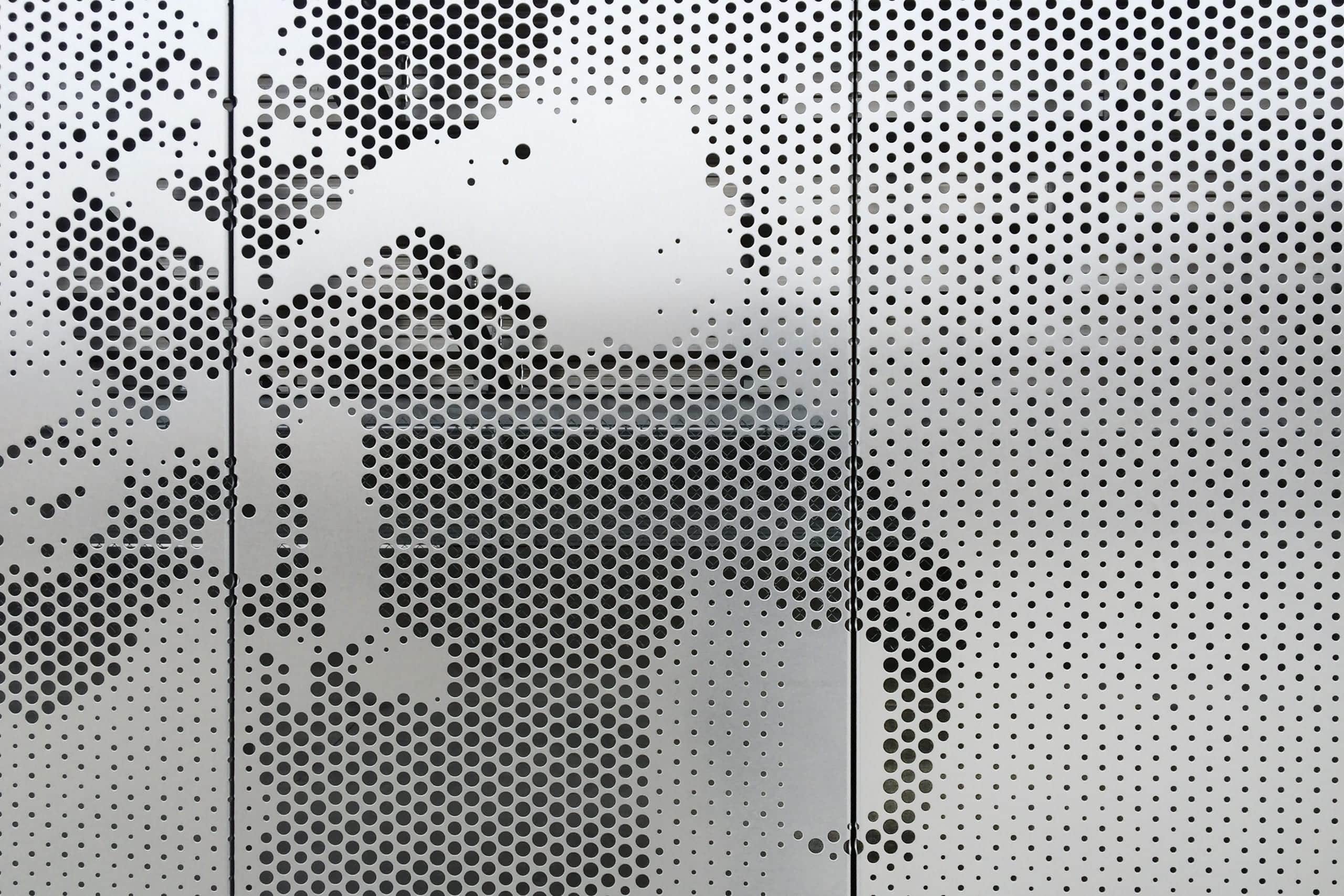 Detail of the Okie Blanchard Sports Complex perforated stainless steel.