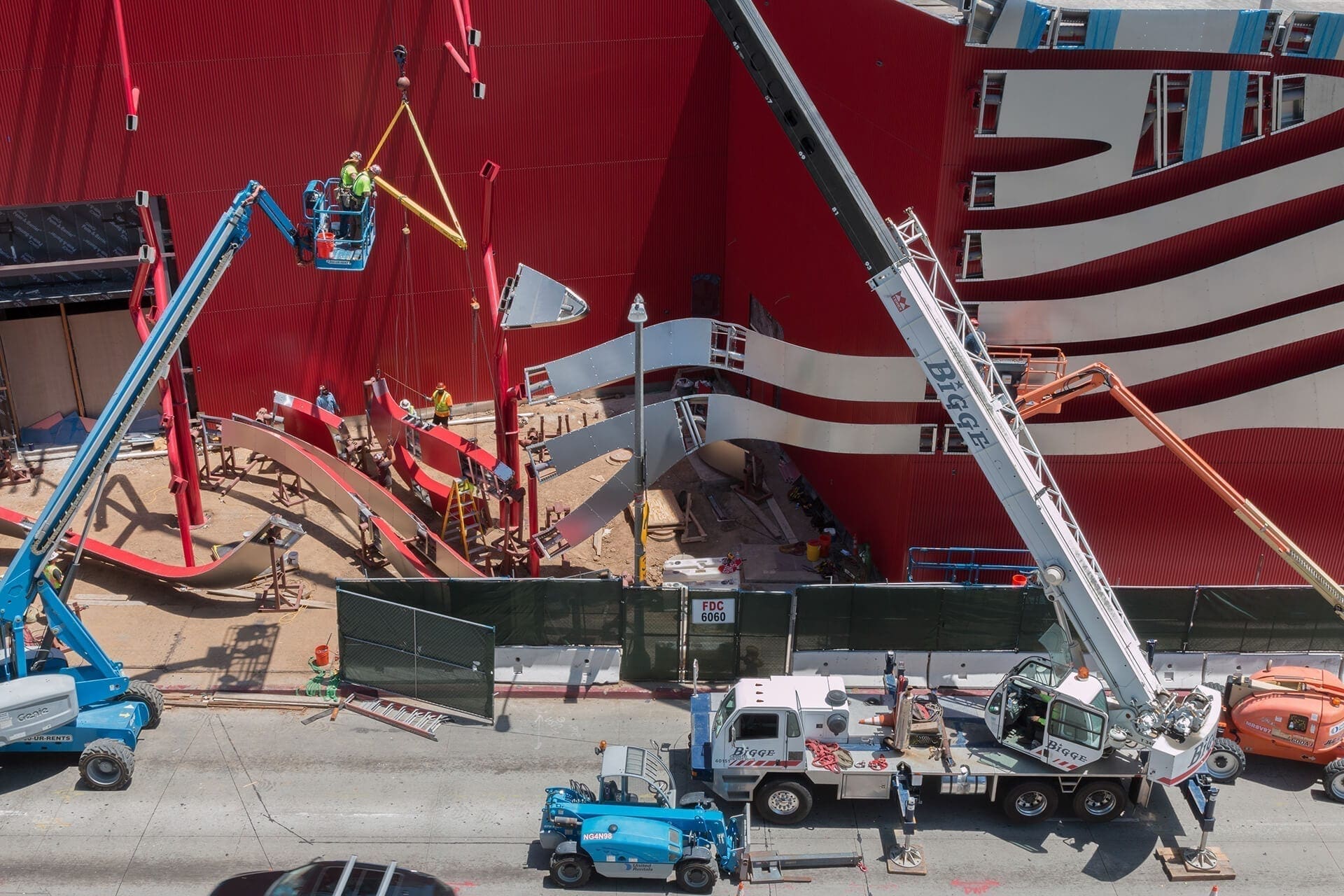 Zahner installers hang a ZEPPS Ribbon Assembly at the Petersen Automotive Museum.