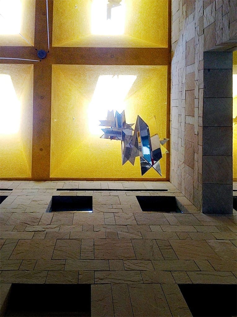 Upward view of individual hanging sculptures by Ricardo Regazzoni.