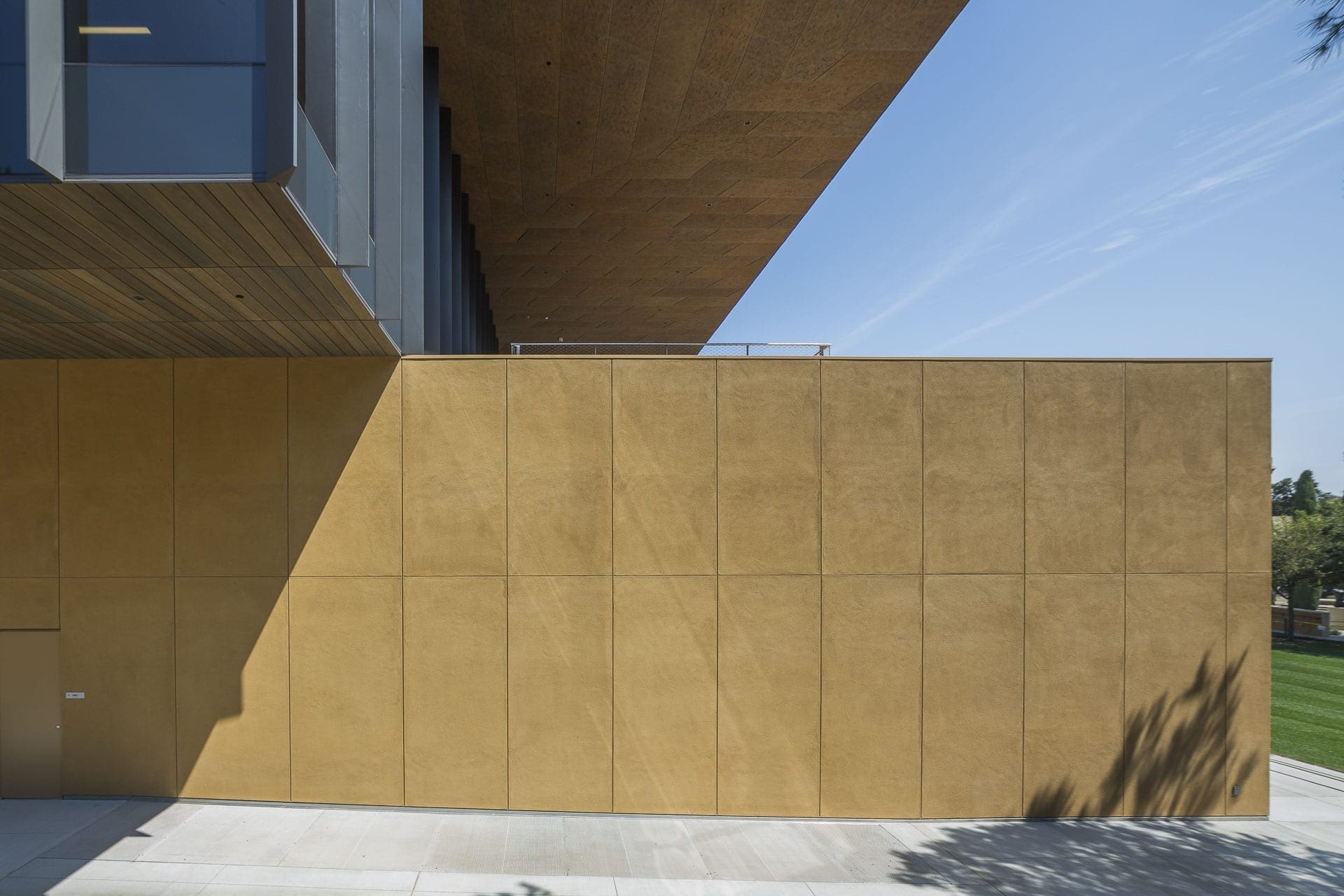 The soffit area is detailed with a preweatehred custom zinc with custom panel-patterns.