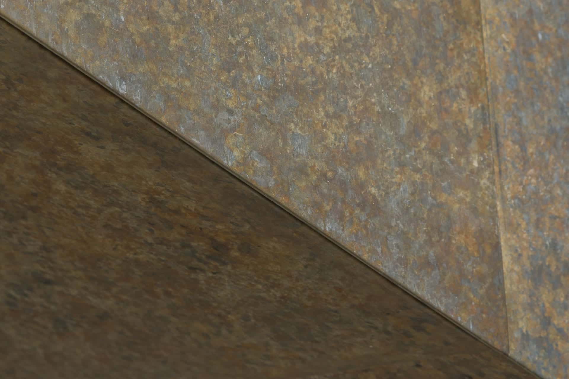 Detailed of the corner where the zinc facade meets the zinc soffit.