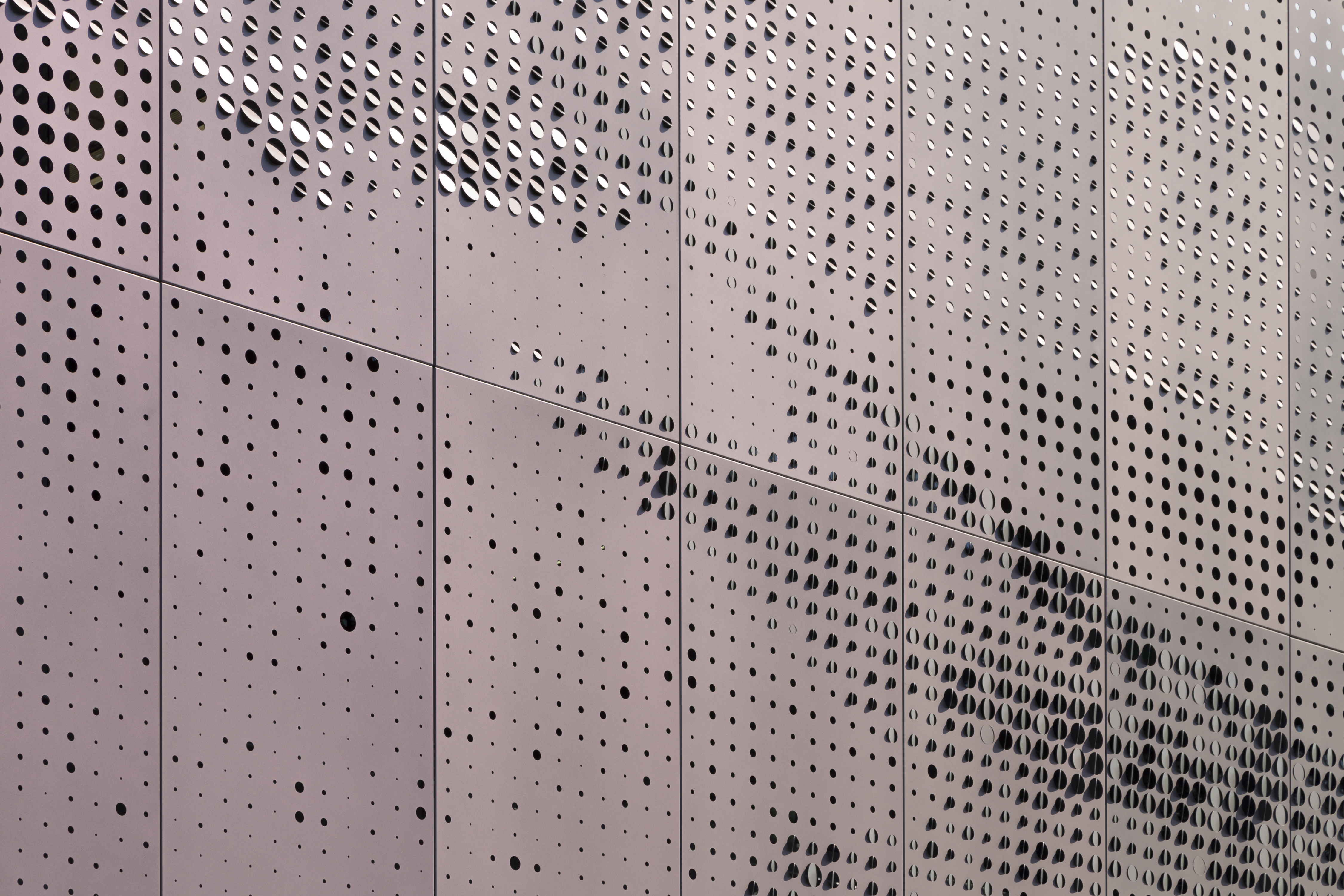 Detail: Zahner patented Louvered ZIRA perforated panels. Color-shifting paint by Valspar.