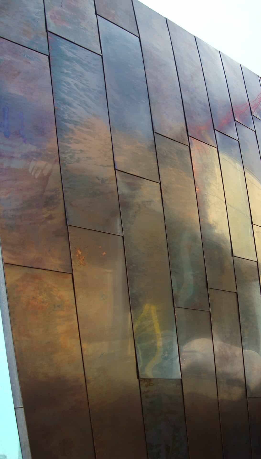 Detail of the custom patina on copper panels for the Waipolu Gallery.