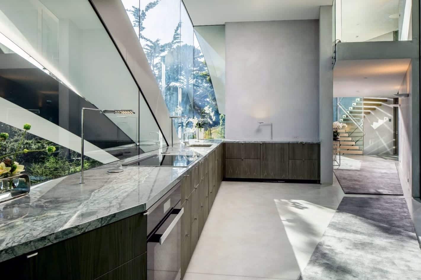 Interior stainless steel fascia divides the kitchen fenestration.