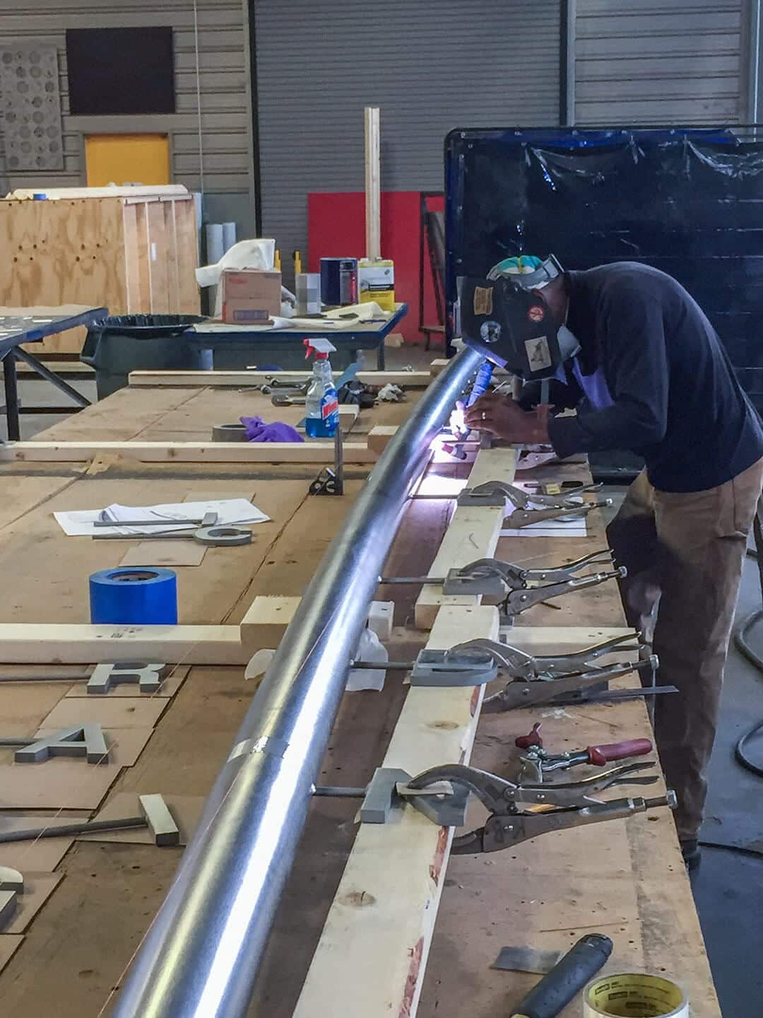 Fabricators at Zahner manufacture the signage and donor recognition for the SDCL Violin Bow.