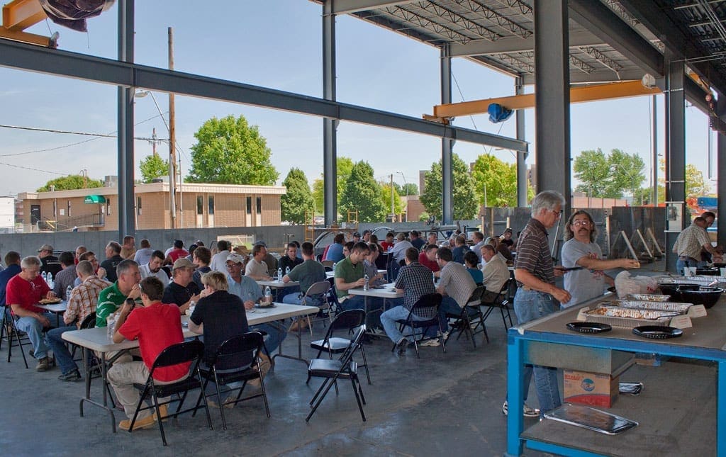 Zahner employees have a safety lunch in the shop prior to the Cloudwall Installation.