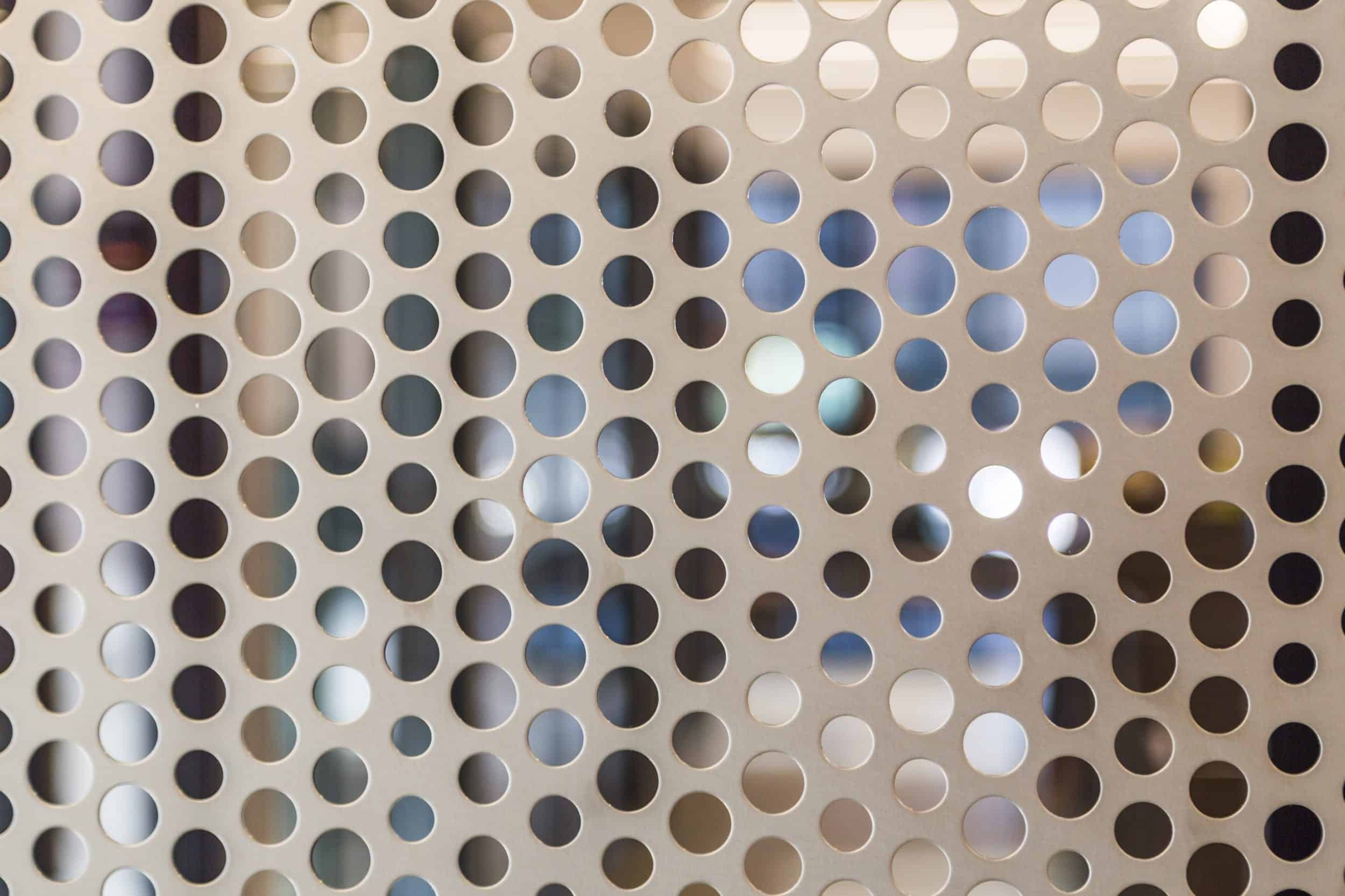 Free-standing screen in Angel Hair Stainless Steel with a painted aluminum backing for office lobby.