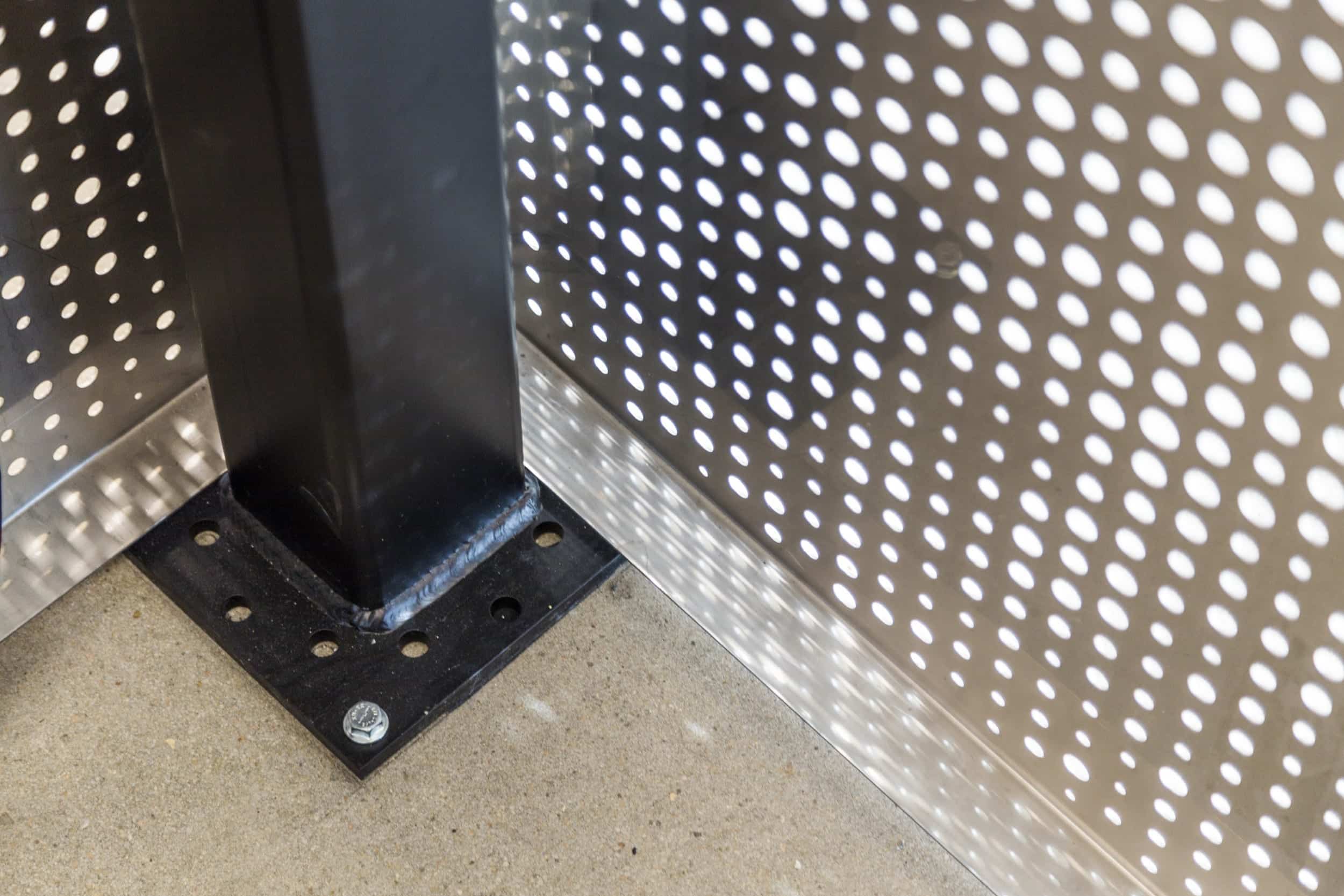 Free-standing screen in Angel Hair Stainless Steel with a painted aluminum backing for office lobby.