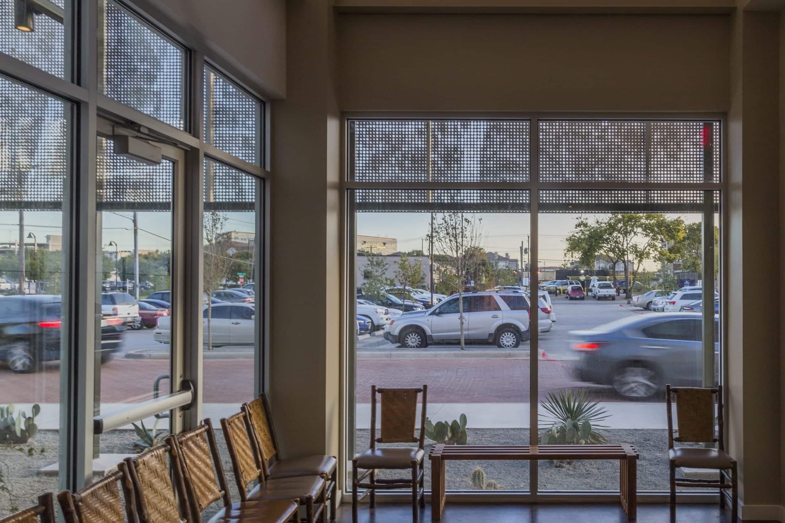 Restaurant facade and ImageWall screen in angel hair stainless steel with imagery of tree branches.
