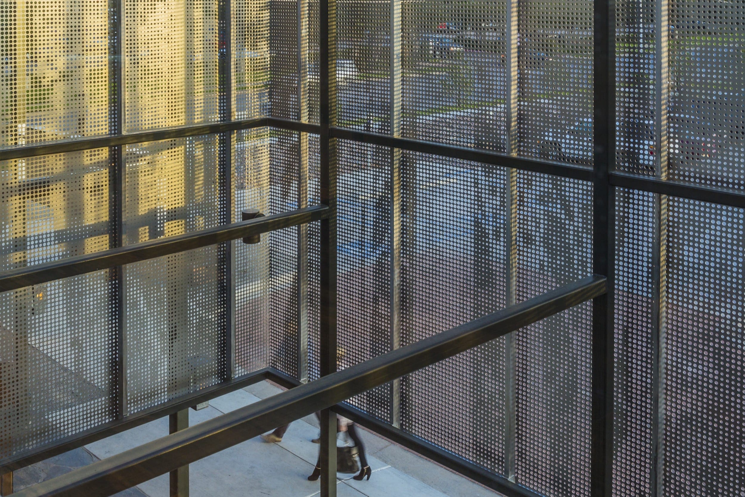Restaurant facade and ImageWall screen in angel hair stainless steel with imagery of tree branches.