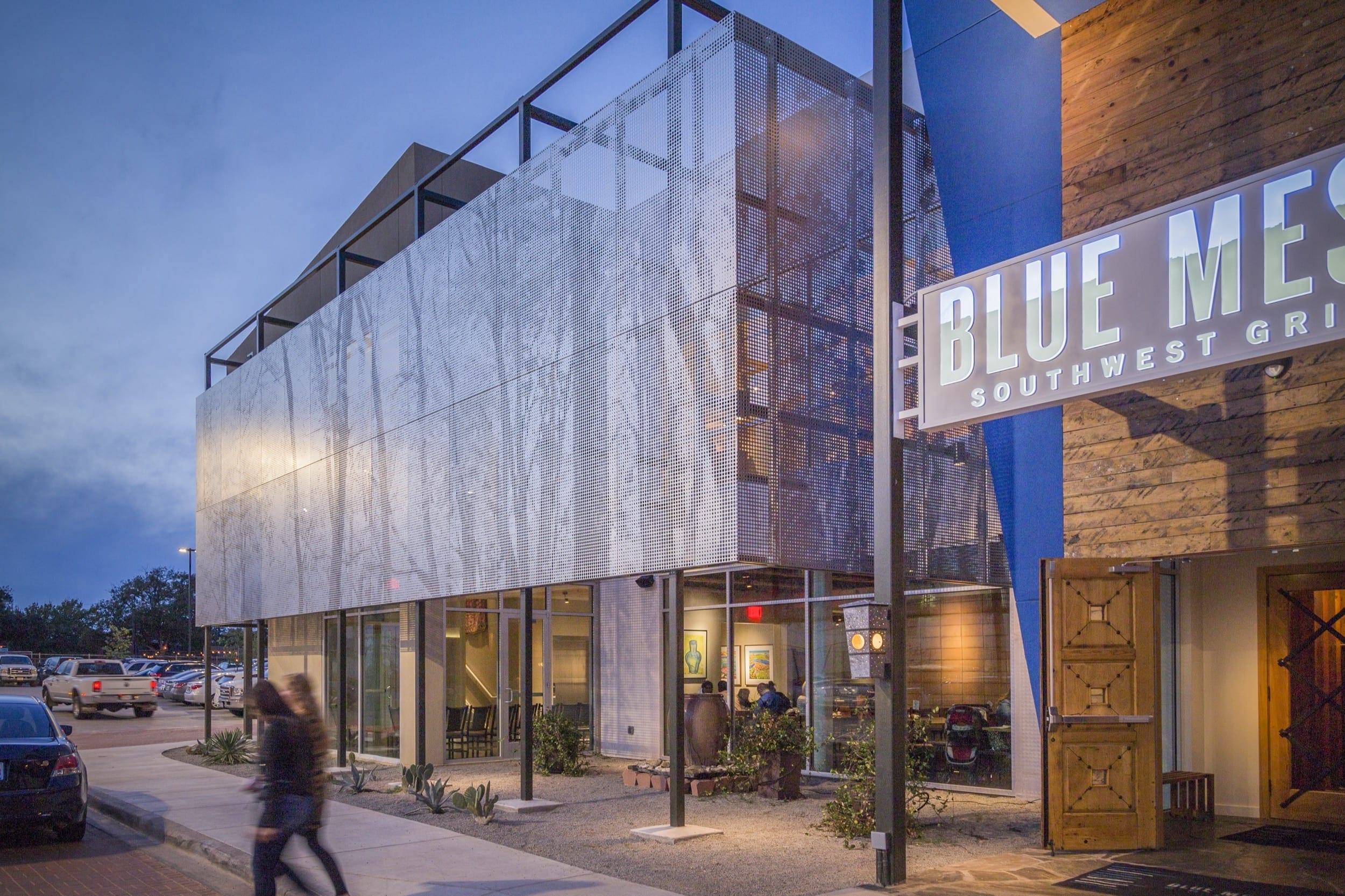 Restaurant facade and ImageWall screen in angel hair stainless steel with imagery of tree branches.