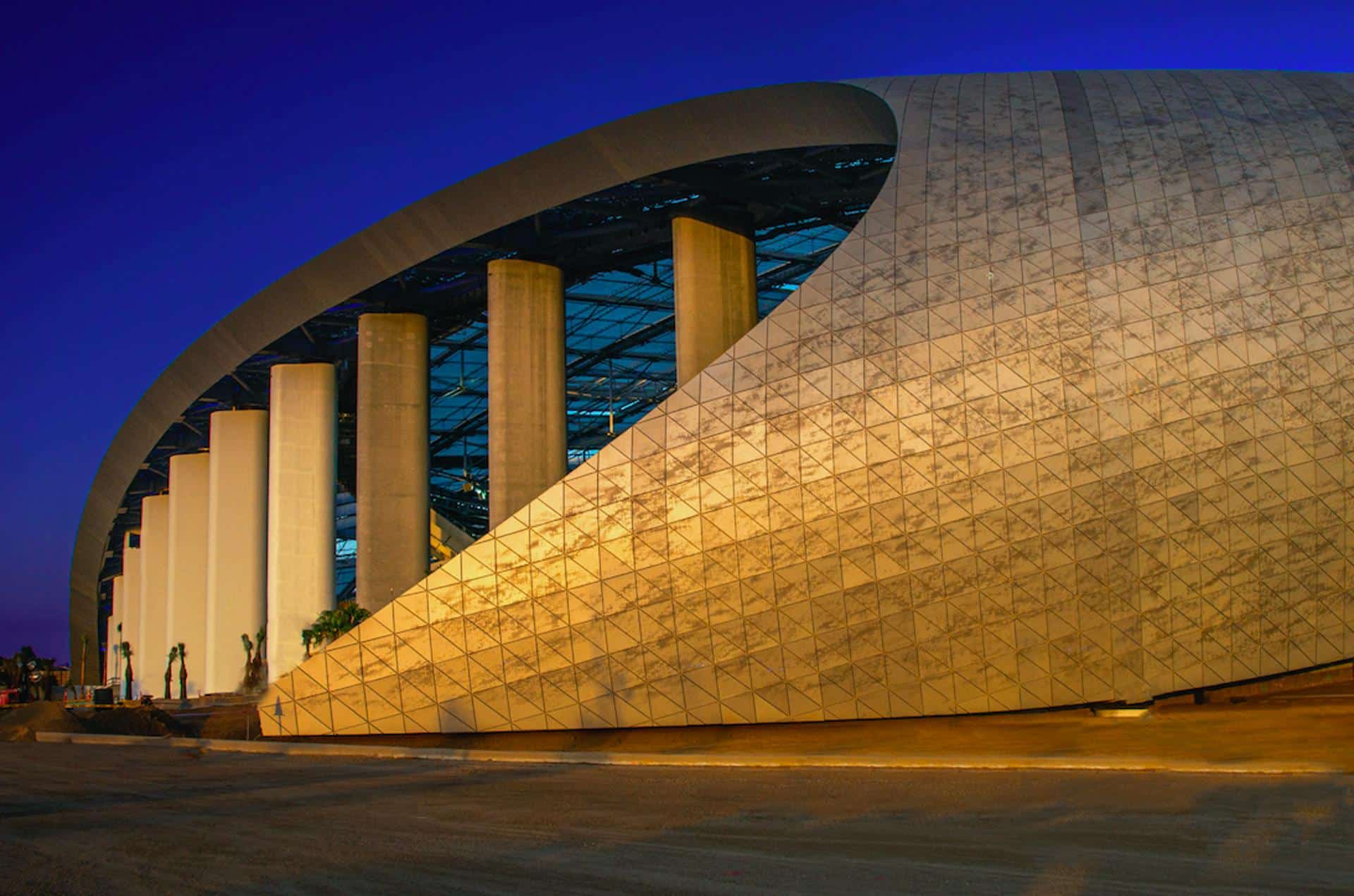 HKS designed a unique canopy and skin for SoFi Stadium featuring custom-perforated anodized aluminum panels from Zahner.