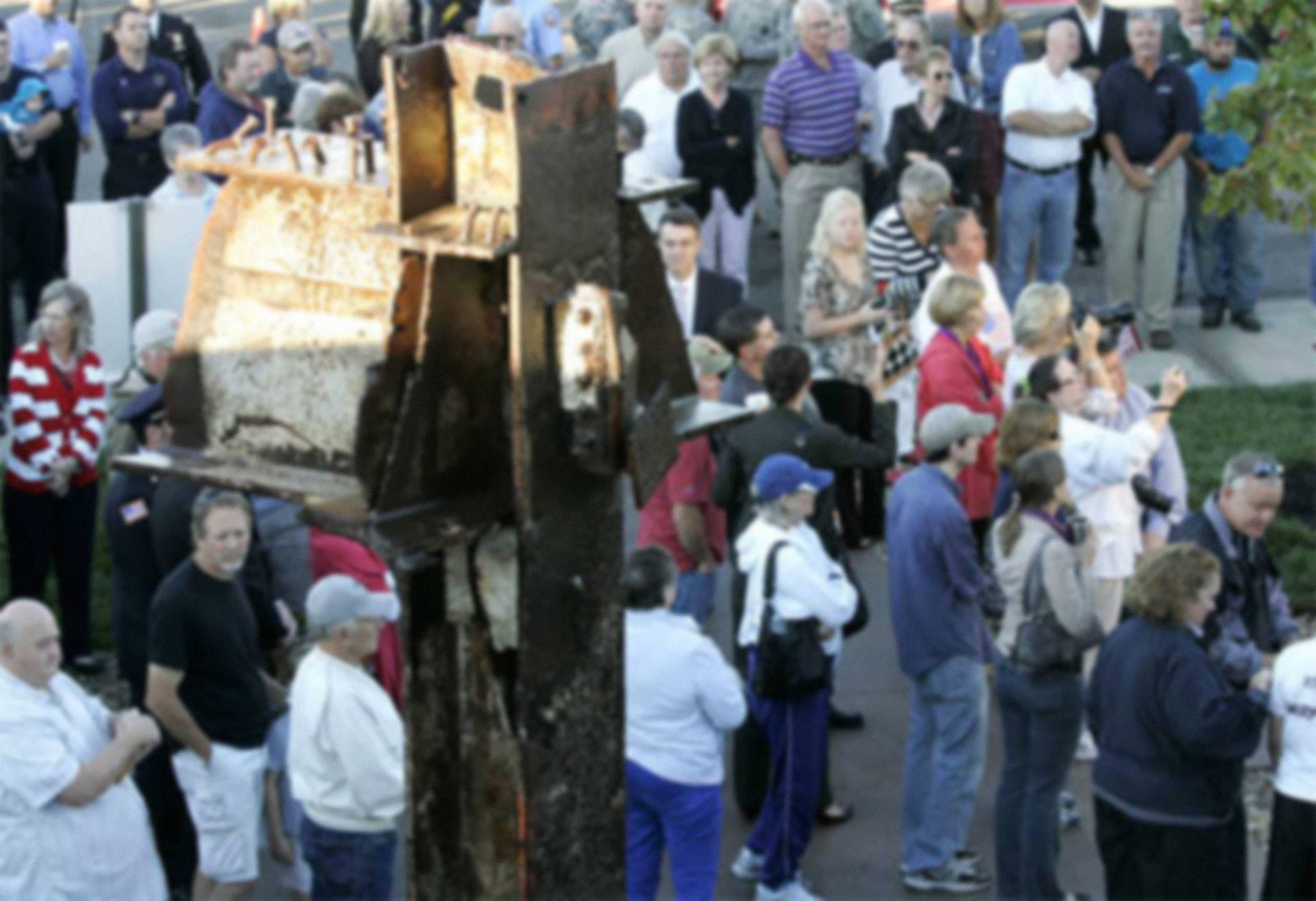 Overland Park Fire Chief Bryan Dehner started the ceremony in front of a huge piece of the World Trade Center.
