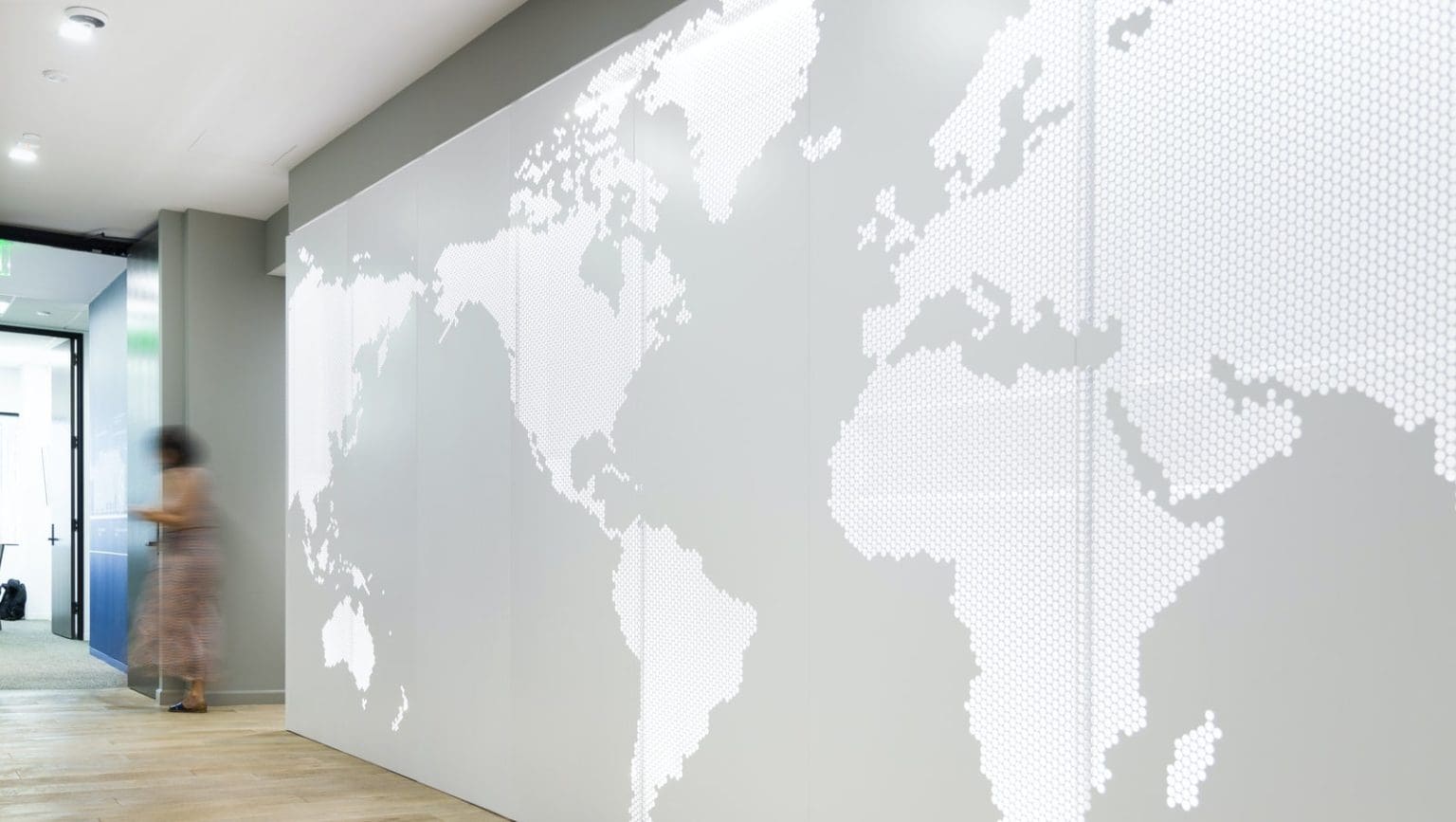 Lineage Logistics by Gensler: Using ImageWall, Gensler designed a feature wall for Lineage Logistics. This gleaming lobby wall is made of painted aluminum, with depth allowance for backlighting. A clean illustration of the world is carved out on the surface of the wall, signifying the international reach of the company.