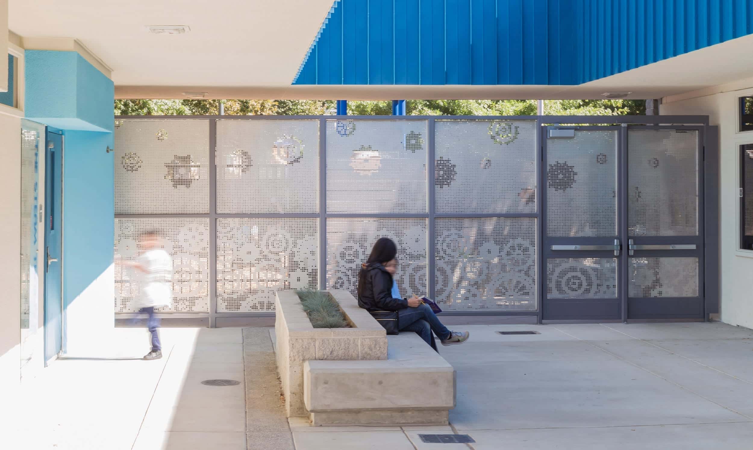 A clever perforated screen wall protects and inspires.