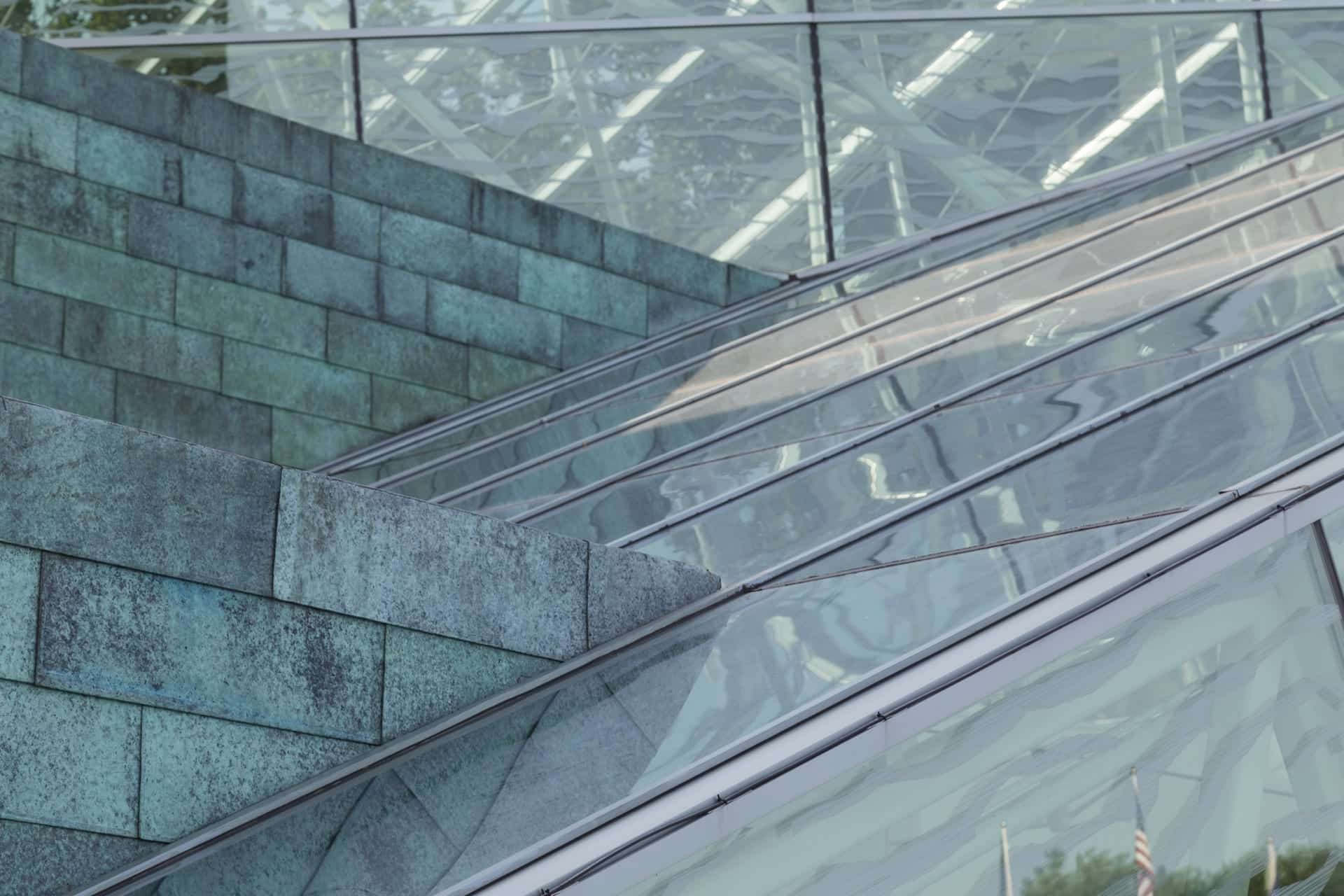 DETAIL OF THE COPPER AND GLASS FACADE OF SUNY NEW PALTZ.