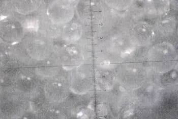 MICROSCOPE PHOTOGRAPHS COMPARING GB-60 STAINLESS STEEL WITH ANGEL HAIR® STAINLESS STEEL.